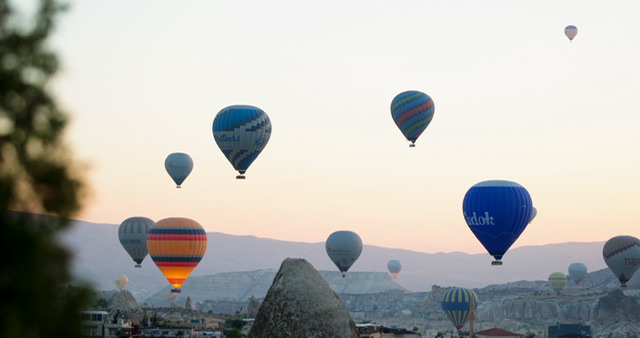 Balloons obove the caves in Cappadocia